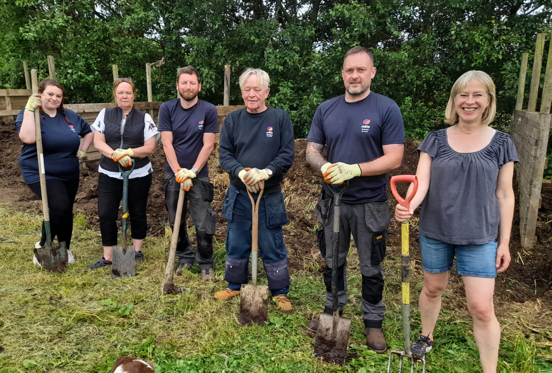 The Mitie team digging at the Farm